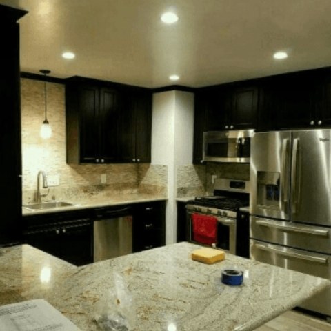 Kitchen with black cabinets and new counter top